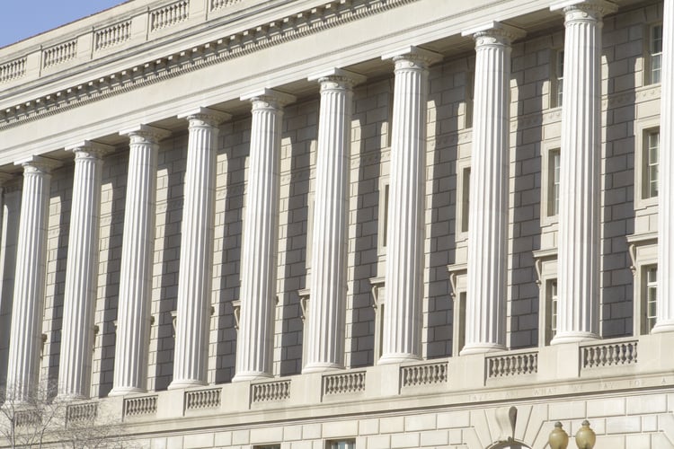 The exterior of a government building with grandiose columns